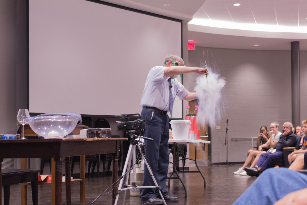 Dunking normal objects, like a flower, into liquid nitrogen makes them brittle enough to disintegrate with a firm squeeze, as Dr. Phillips gladly demonstrated!